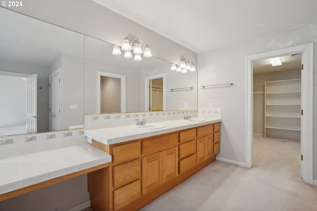 bathroom with vanity and decorative backsplash