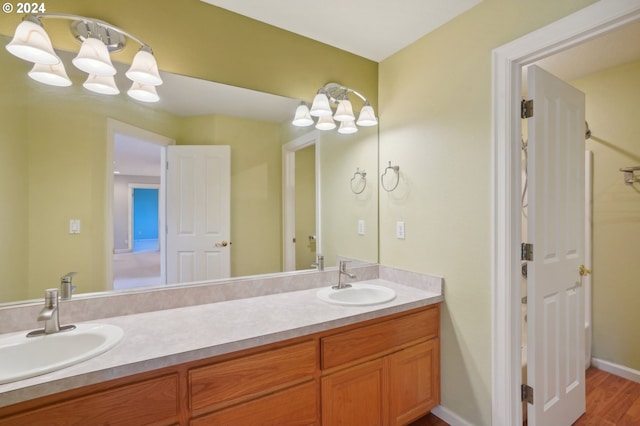 bathroom featuring hardwood / wood-style flooring and vanity