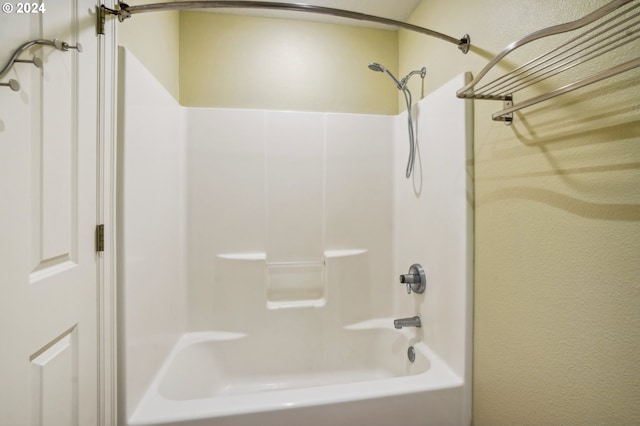 bathroom with shower / washtub combination