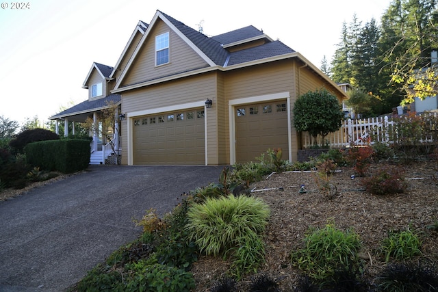 view of side of home with a garage