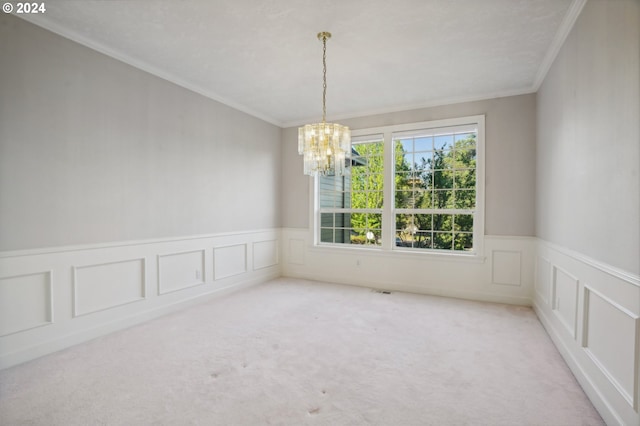 carpeted spare room with crown molding and a chandelier