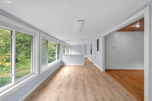 33062 Bellcrest Rd, Scappoose, OR 97056 - unfurnished sunroom featuring baseboards and wood finished floors