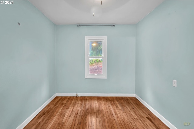 empty room with light hardwood / wood-style flooring