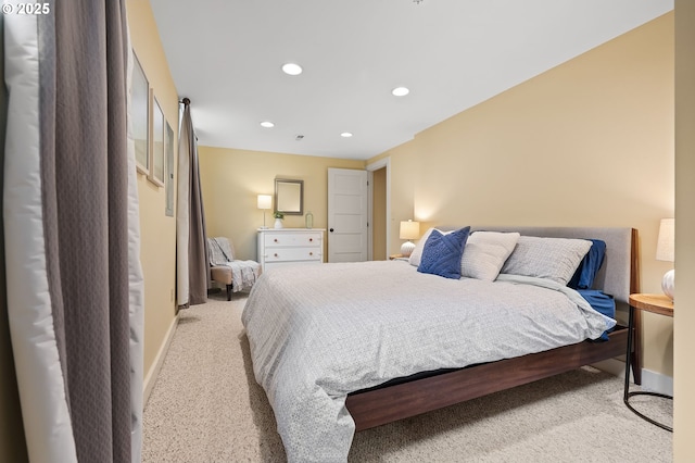 bedroom featuring baseboards, light colored carpet, and recessed lighting