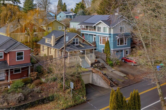 birds eye view of property with a residential view