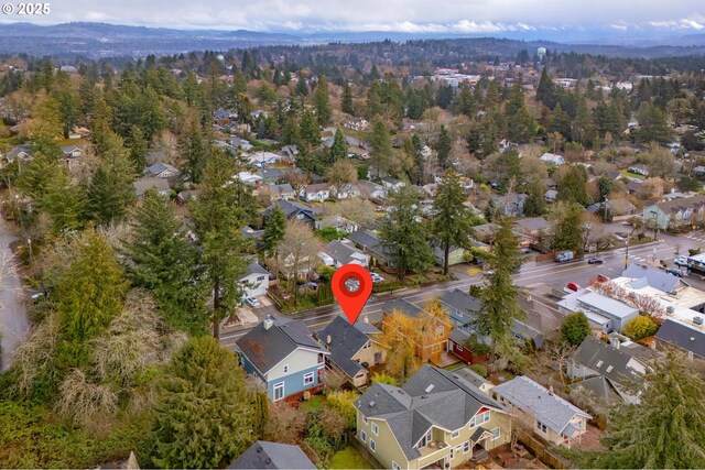 birds eye view of property with a residential view