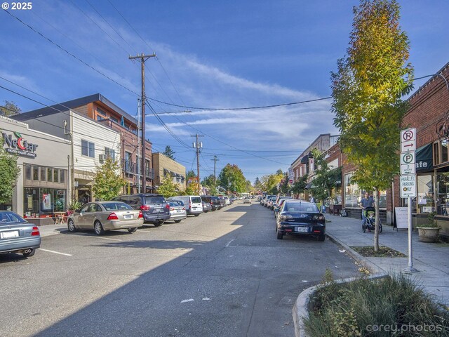 view of road with curbs and sidewalks