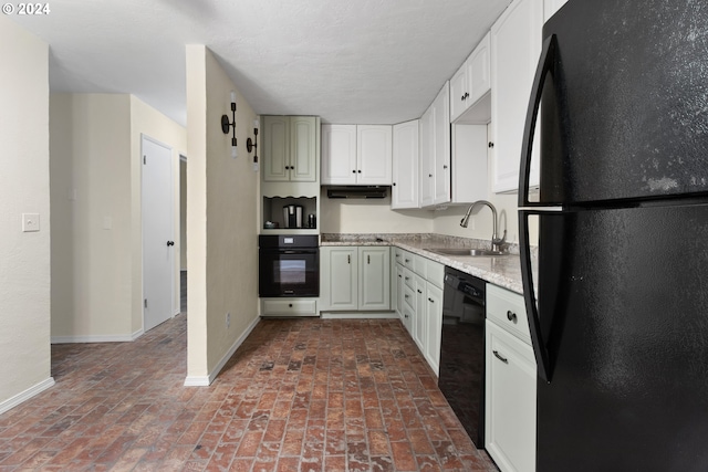 kitchen featuring white cabinetry, black appliances, and sink