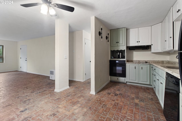 kitchen with black appliances, white cabinetry, ceiling fan, and decorative columns