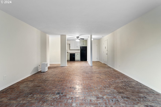 unfurnished living room featuring ceiling fan