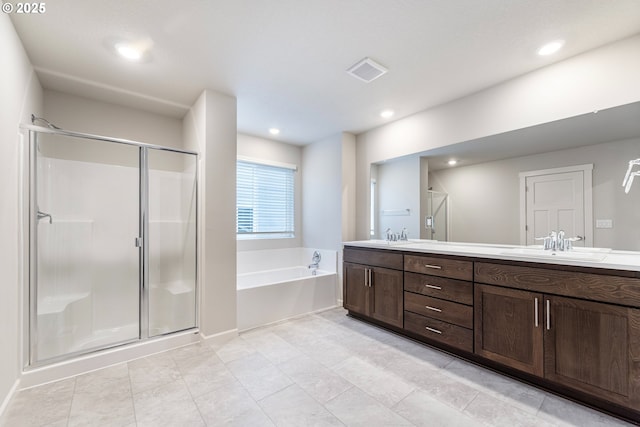 11383 NW 314th Ave, North Plains, OR 97133 - full bath featuring a garden tub, double vanity, a stall shower, recessed lighting, and tile patterned flooring