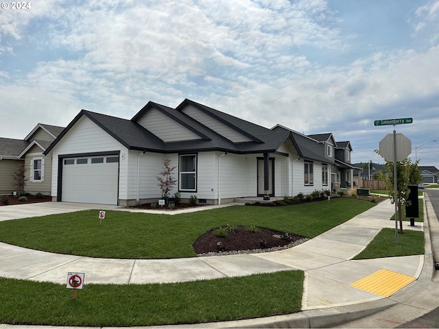 view of front facade featuring a garage and a front lawn