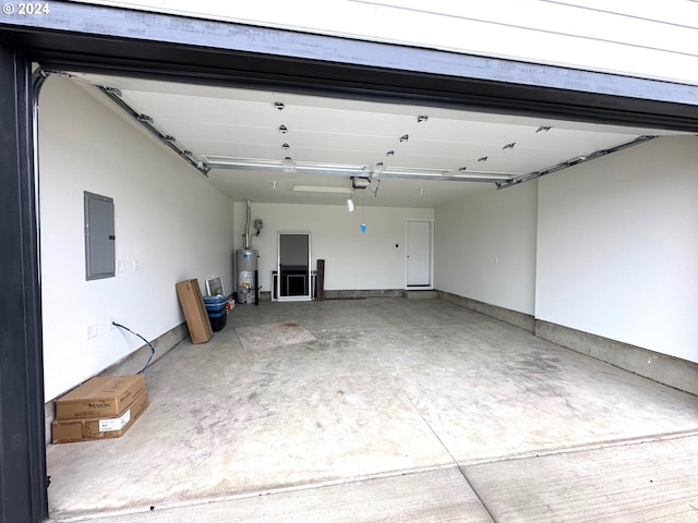 garage with electric panel, water heater, and a garage door opener