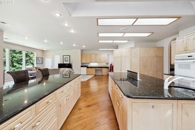 92631 Rainier Ln, Coos Bay, OR 97420 - kitchen featuring double oven, light brown cabinetry, light wood-type flooring, black electric cooktop, and recessed lighting
