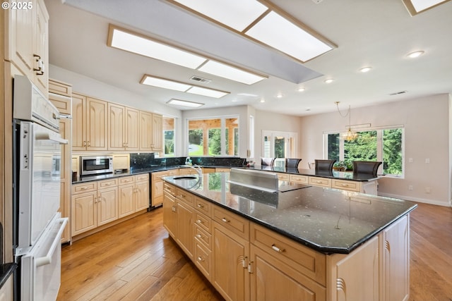 92631 Rainier Ln, Coos Bay, OR 97420 - kitchen featuring a large island, healthy amount of natural light, light wood-type flooring, and recessed lighting