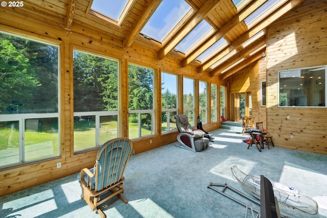 92631 Rainier Ln, Coos Bay, OR 97420 - unfurnished sunroom featuring a skylight, wooden walls, carpet, beam ceiling, and high vaulted ceiling