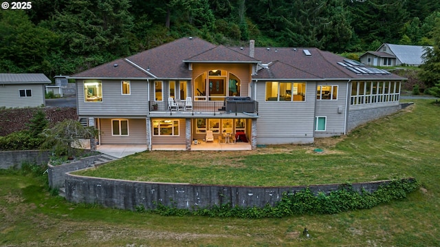 92631 Rainier Ln, Coos Bay, OR 97420 - rear view of property featuring a patio area, a yard, and a balcony