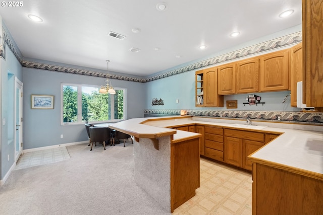92631 Rainier Ln, Coos Bay, OR 97420 - kitchen featuring a peninsula, light countertops, a breakfast bar area, pendant lighting, and recessed lighting