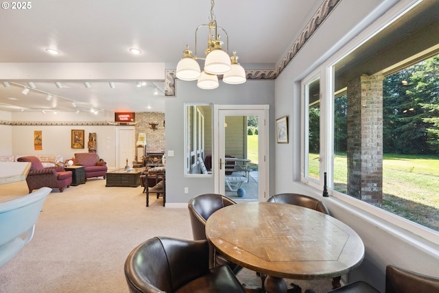 92631 Rainier Ln, Coos Bay, OR 97420 - dining room featuring plenty of natural light, a chandelier, carpet, and track lighting