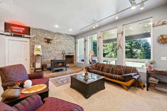 92631 Rainier Ln, Coos Bay, OR 97420 - living area featuring a wood stove and carpet flooring