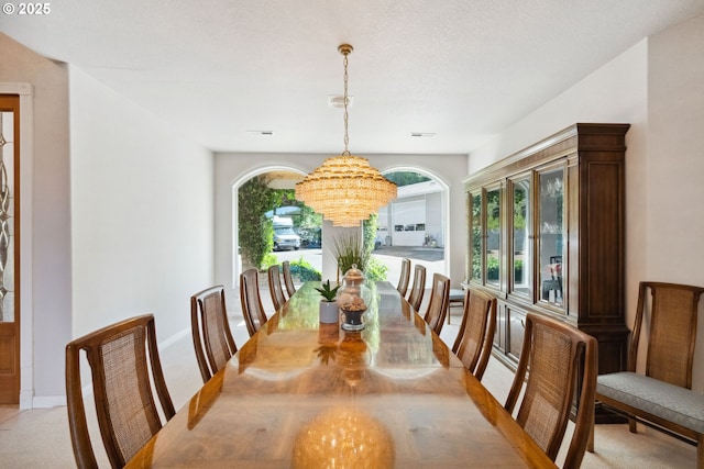 92631 Rainier Ln, Coos Bay, OR 97420 - dining room with a chandelier and light colored carpet