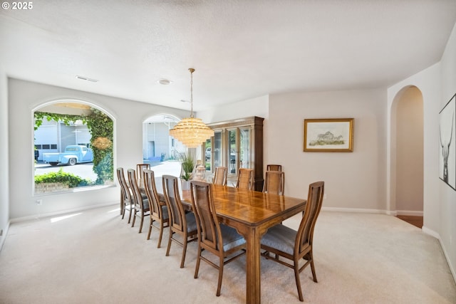 92631 Rainier Ln, Coos Bay, OR 97420 - dining space with light carpet and arched walkways