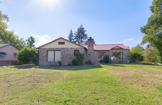 ranch-style house with a front lawn