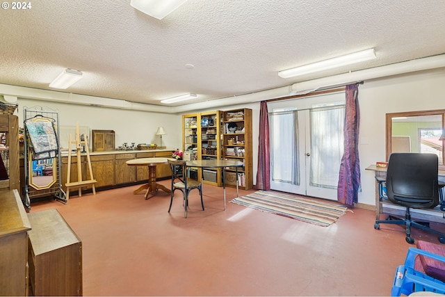 office space featuring concrete flooring and a textured ceiling