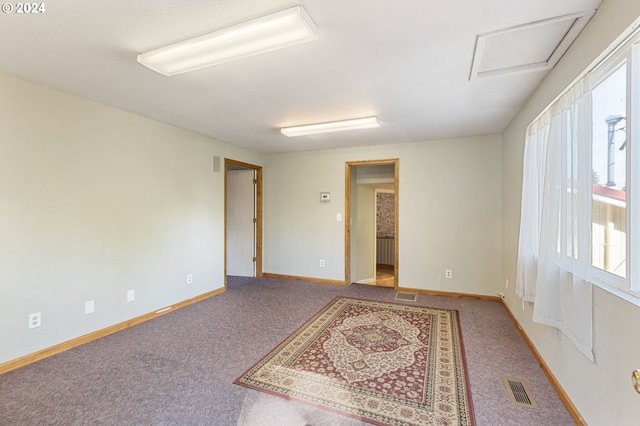 spare room featuring carpet floors