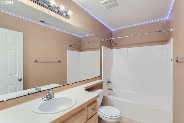 full bathroom featuring toilet, tile patterned flooring, vanity, and shower / bathtub combination