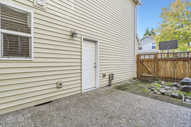 property entrance featuring a patio area