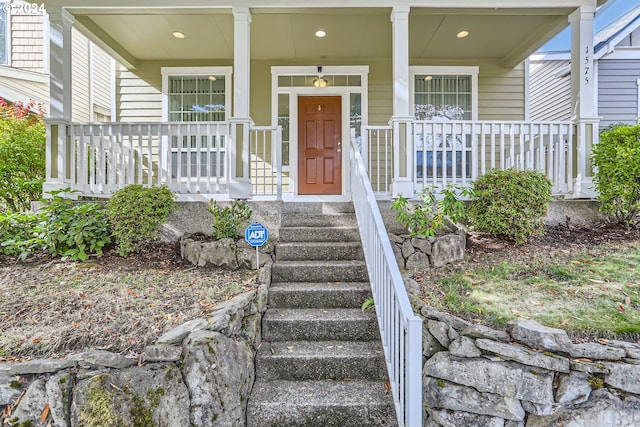 property entrance with covered porch