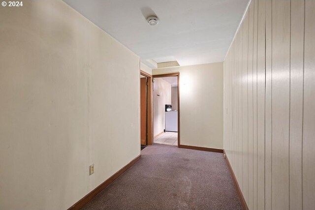 hallway featuring carpet flooring