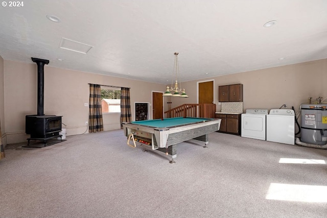 rec room featuring billiards, separate washer and dryer, a wood stove, light carpet, and secured water heater