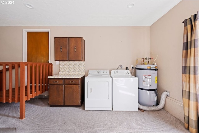 laundry room with cabinets, strapped water heater, washer and dryer, and light colored carpet