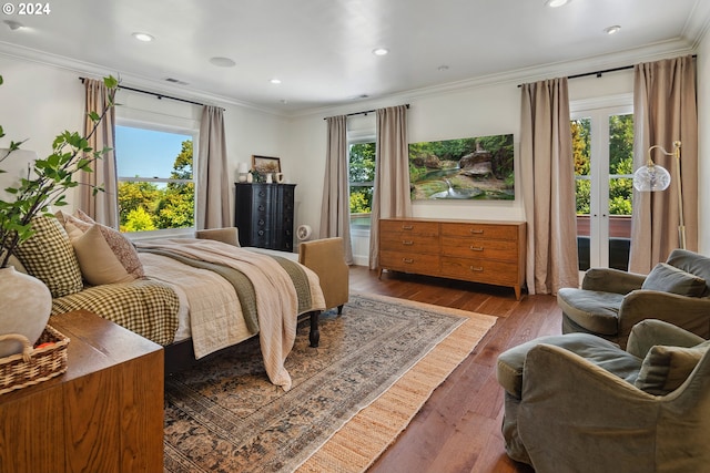 bedroom featuring french doors, hardwood / wood-style flooring, and crown molding