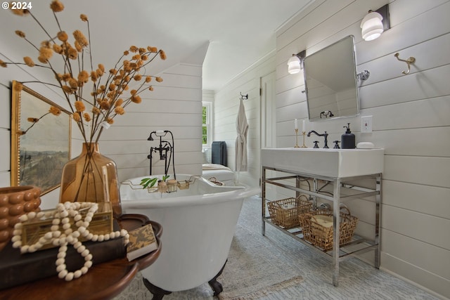 bathroom featuring wood walls and a bathing tub