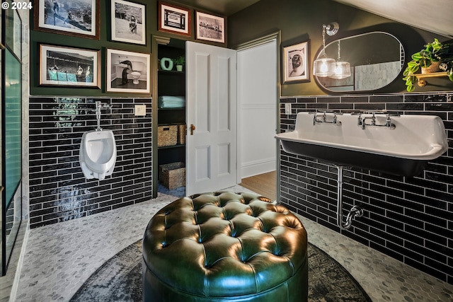 bathroom featuring tile walls and hardwood / wood-style floors