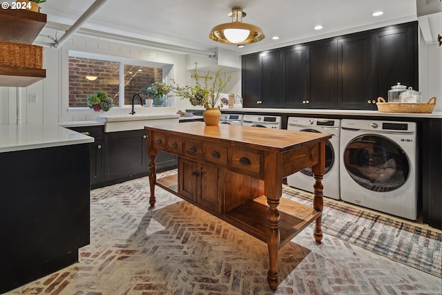 washroom featuring separate washer and dryer and sink