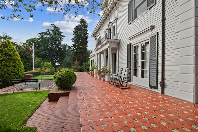 view of patio with a balcony