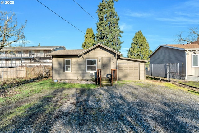 back of property featuring a garage