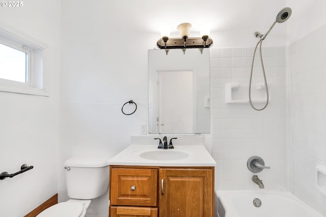 full bathroom featuring vanity, toilet, and tiled shower / bath combo