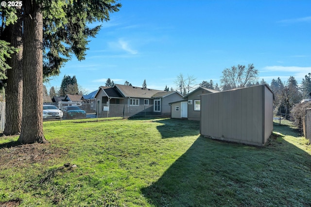 view of yard with a storage unit