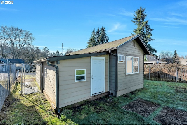 view of outbuilding with a lawn