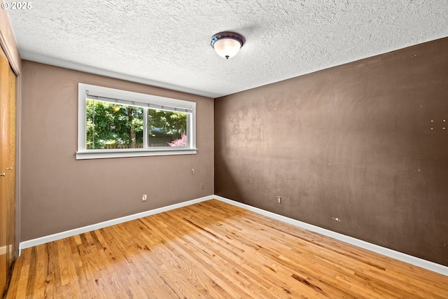 18021 Tualata Ave, Lake Oswego, OR 97035 - unfurnished room with wood finished floors and a textured ceiling