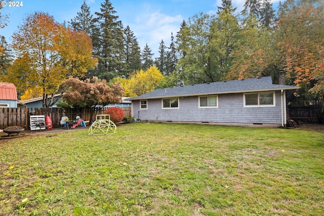 18021 Tualata Ave, Lake Oswego, OR 97035 - back of property featuring a fenced backyard, an outdoor fire pit, and crawl space