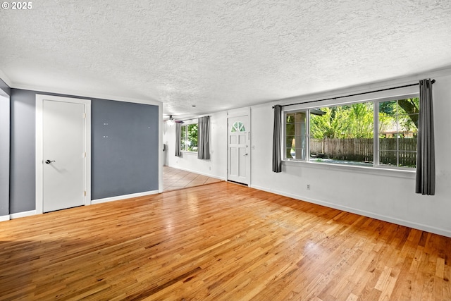 18021 Tualata Ave, Lake Oswego, OR 97035 - spare room with wood finished floors, plenty of natural light, a textured ceiling, and a ceiling fan