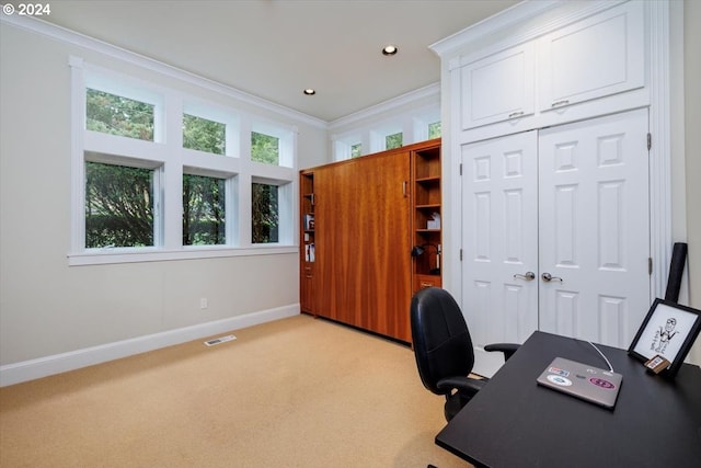 home office with ornamental molding and light carpet