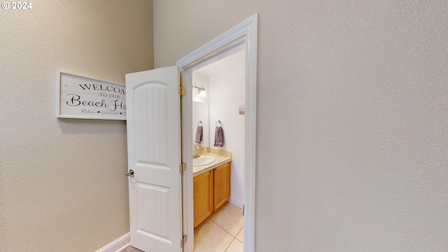 bathroom featuring tile patterned floors and vanity