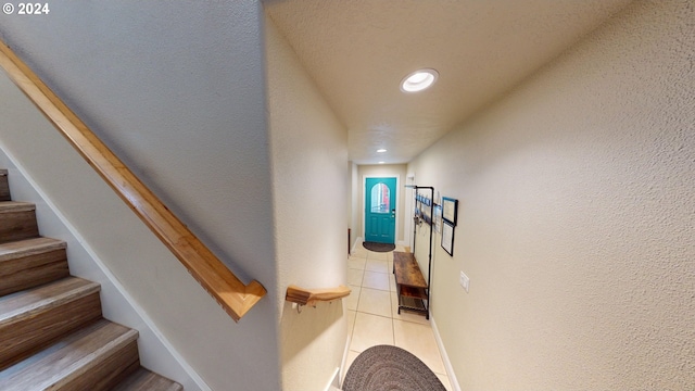 staircase with tile patterned floors